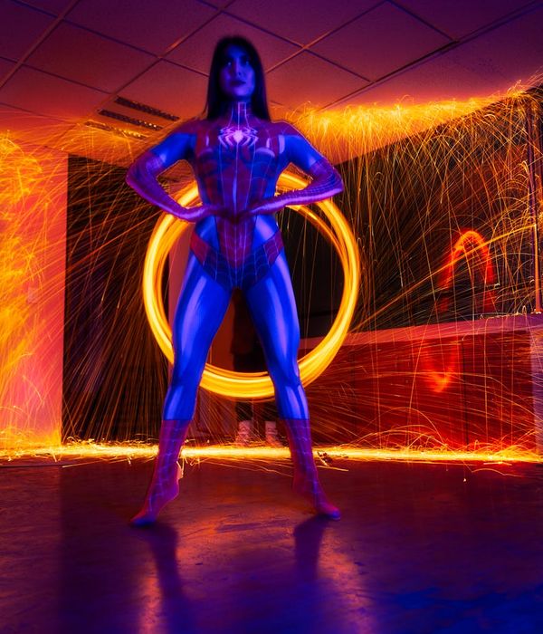 Woman feeling vibrant and full of energy in a bright, sunlit room.